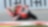 Moto Ducati rouge numéro 7 penchée dans un virage sur circuit, avec pilote portant un casque coloré