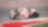 Moto Ducati rouge et blanche n°29 en plein virage sur un circuit de course aux bordures rouges et blanches.