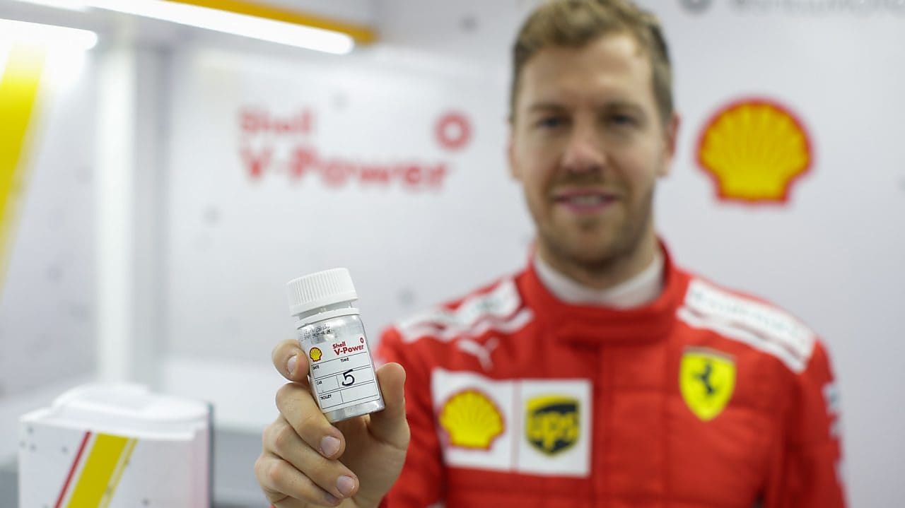 hands holding a v power tube on a shell lab