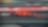 Voiture Ferrari F1 numéro 16 en action sur un circuit de course avec bordures rouge et vert