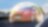 Voiture rouge Ford Fiesta en mouvement sur route, entourée d'un halo lumineux symbolisant la protection ou la sécurité