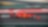 Voiture Ferrari F1 numéro 16 en action sur un circuit de course avec bordures rouge et vert